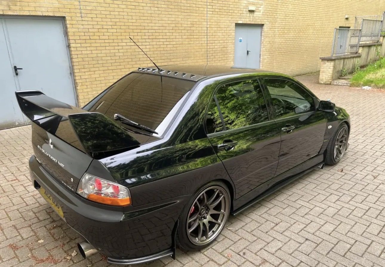 Gloss black Mitsubishi Evo freshly detailed by Holywood Valeting